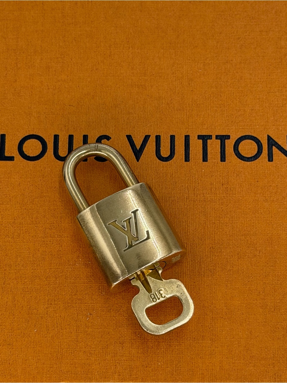 Authentic Louis Vuitton Gold-Tone LV Lock and Key Set